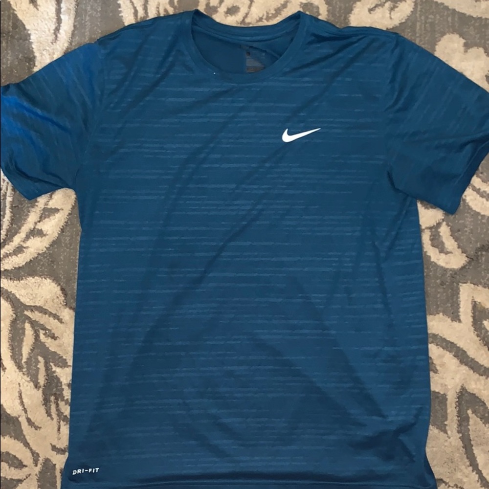 Blue Nike athletic shirt